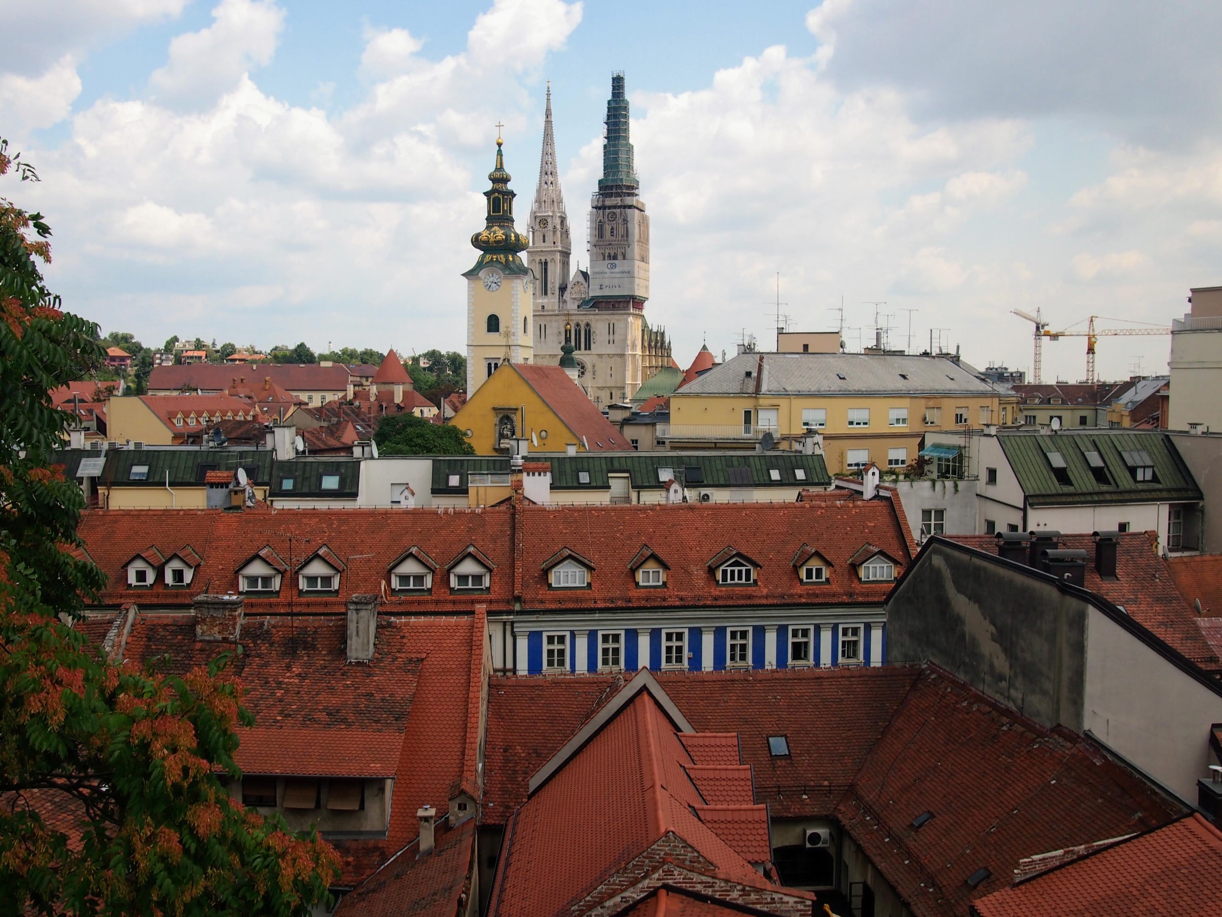 View over rooftops towards large church spires in Zagreb, Croatia