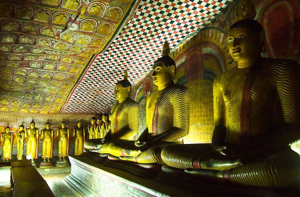 Several golden Buddha statues in Dambulla