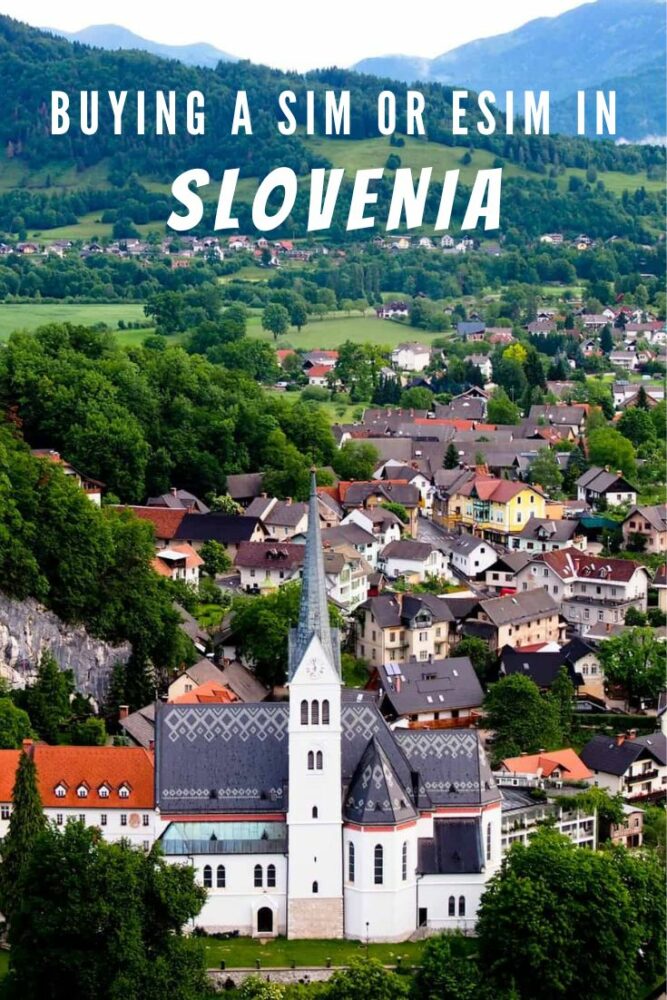 Text "Buying a SIM or eSIM in Slovenia" overlaid on a photo of a village in Slovenia taken from above, with a church in the foreground and hills behind