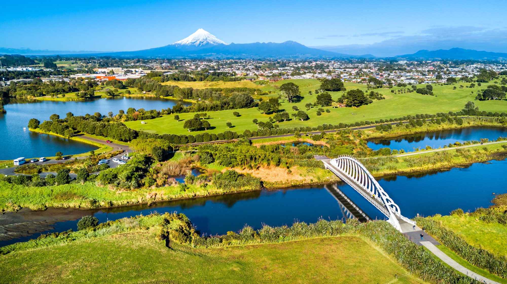 View of the countryside looking over a bridge towards Mount Taranaki, New Zealand