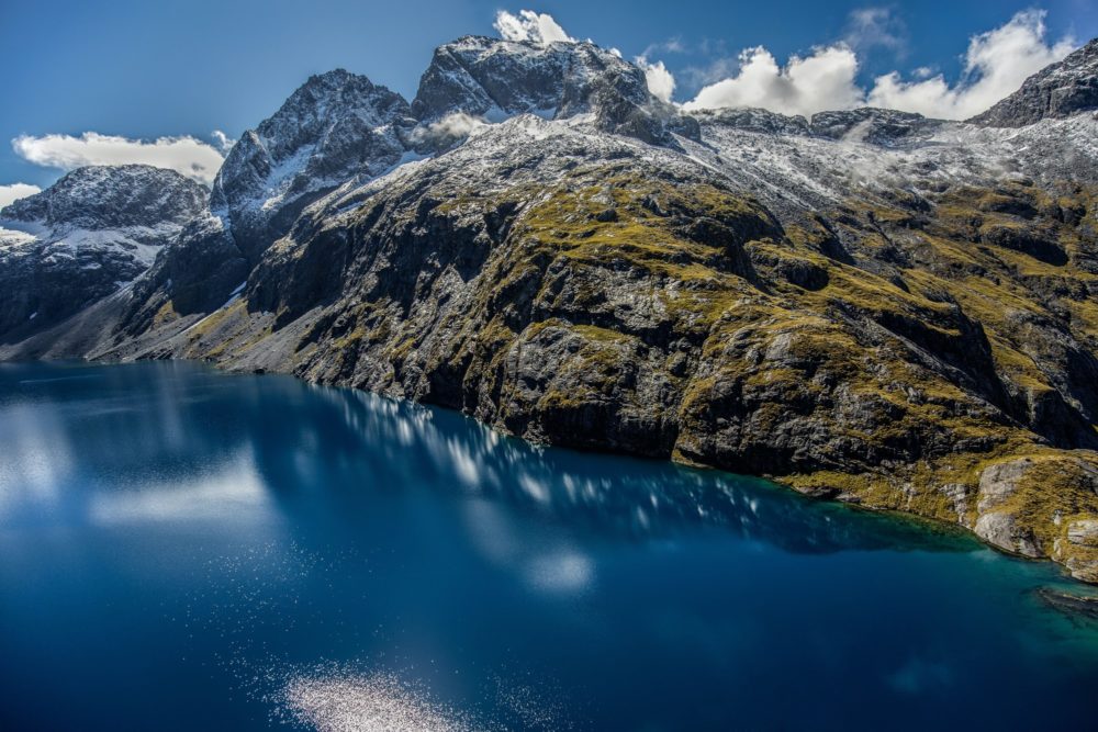 Aerial view of lake and mountains in Fiordland National Park, New Zealand