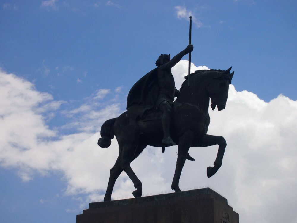 Statue of rider on horseback in Zagreb, Croatia, with sky and clouds in background