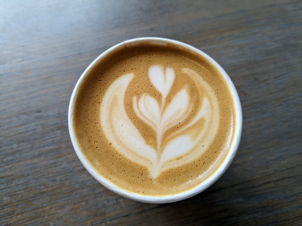 Overhead view of coffee with latte art at Cable Co, Notting Hill