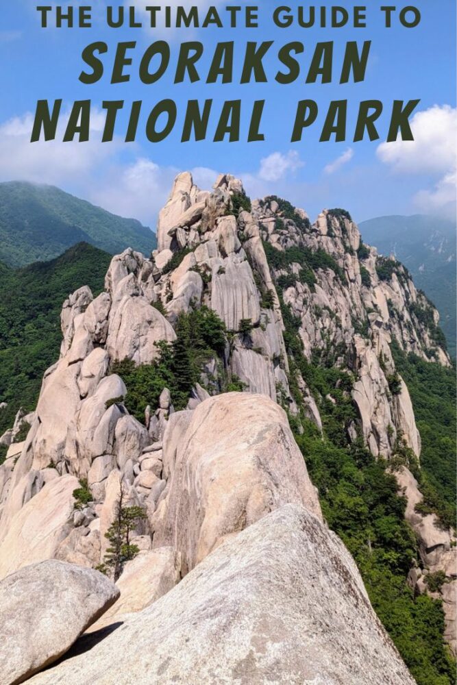 View over steep, jagged granite peaks with forested slopes on both sides. Blue sky with some white clouds above. Text "The Ultimate Guide to Seoraksan National Park" overlaid at top